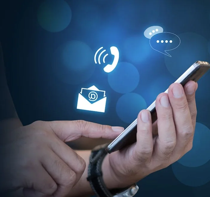 Mobile device in hand, a man demonstrates effective email marketing techniques